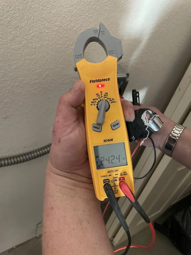 Voltage testing with clamp meter during Ceiling Fan Installation in Wheatfield